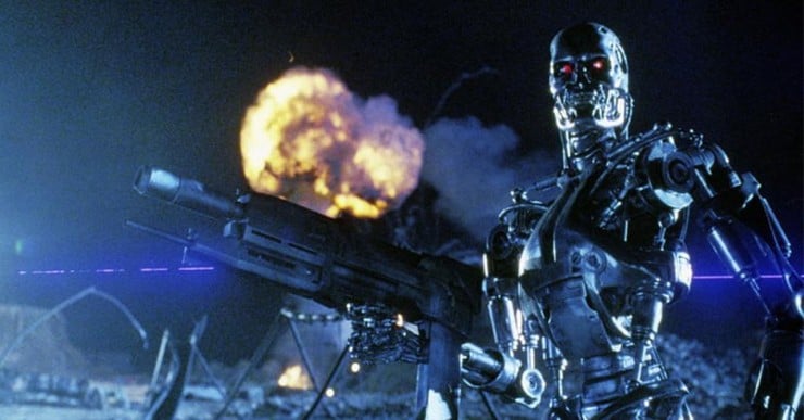 A shot from the movie Terminator 2 of a scary robot holding a gun